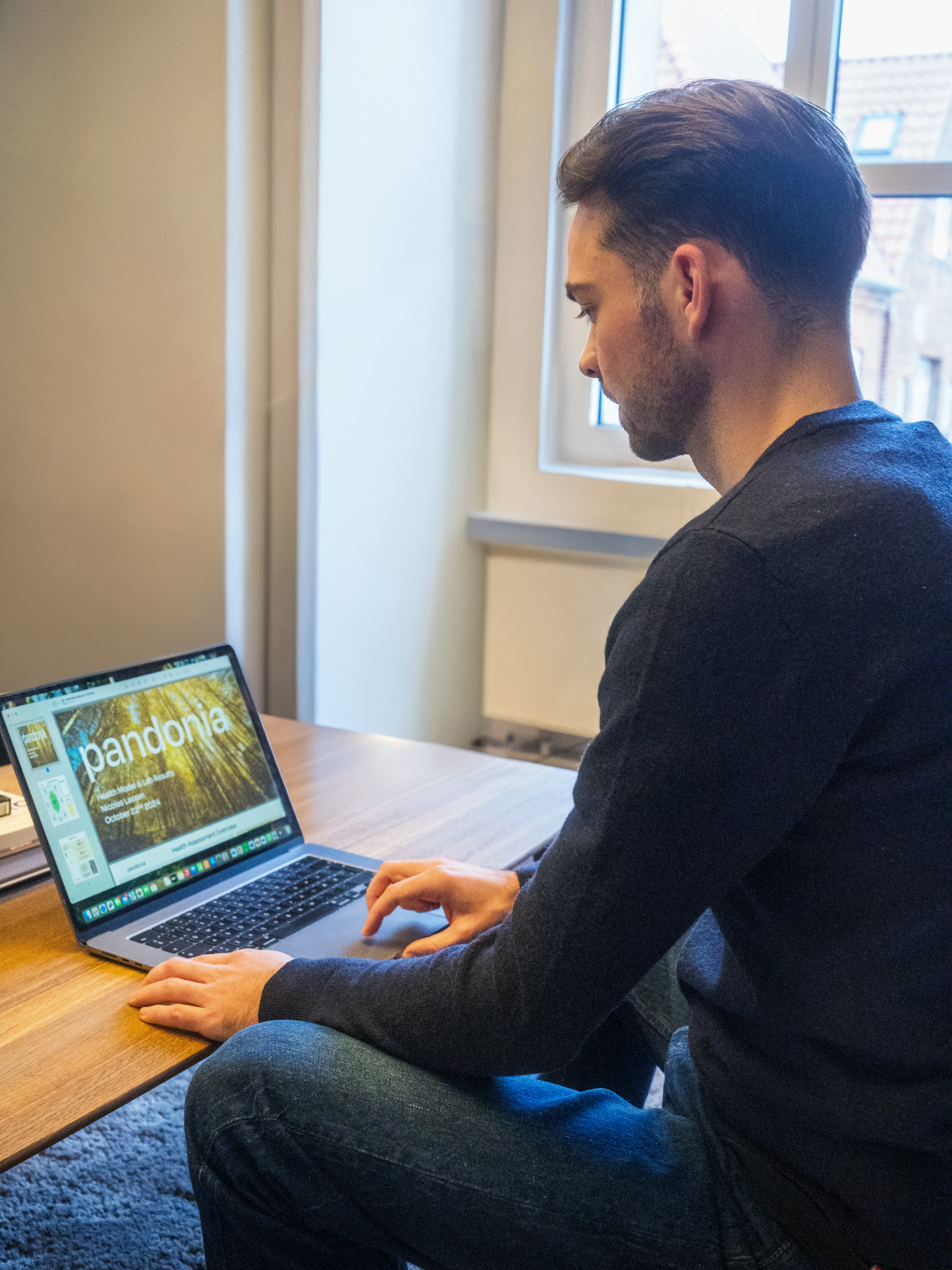 A render of three white cylindrical columns, against a warm creme background