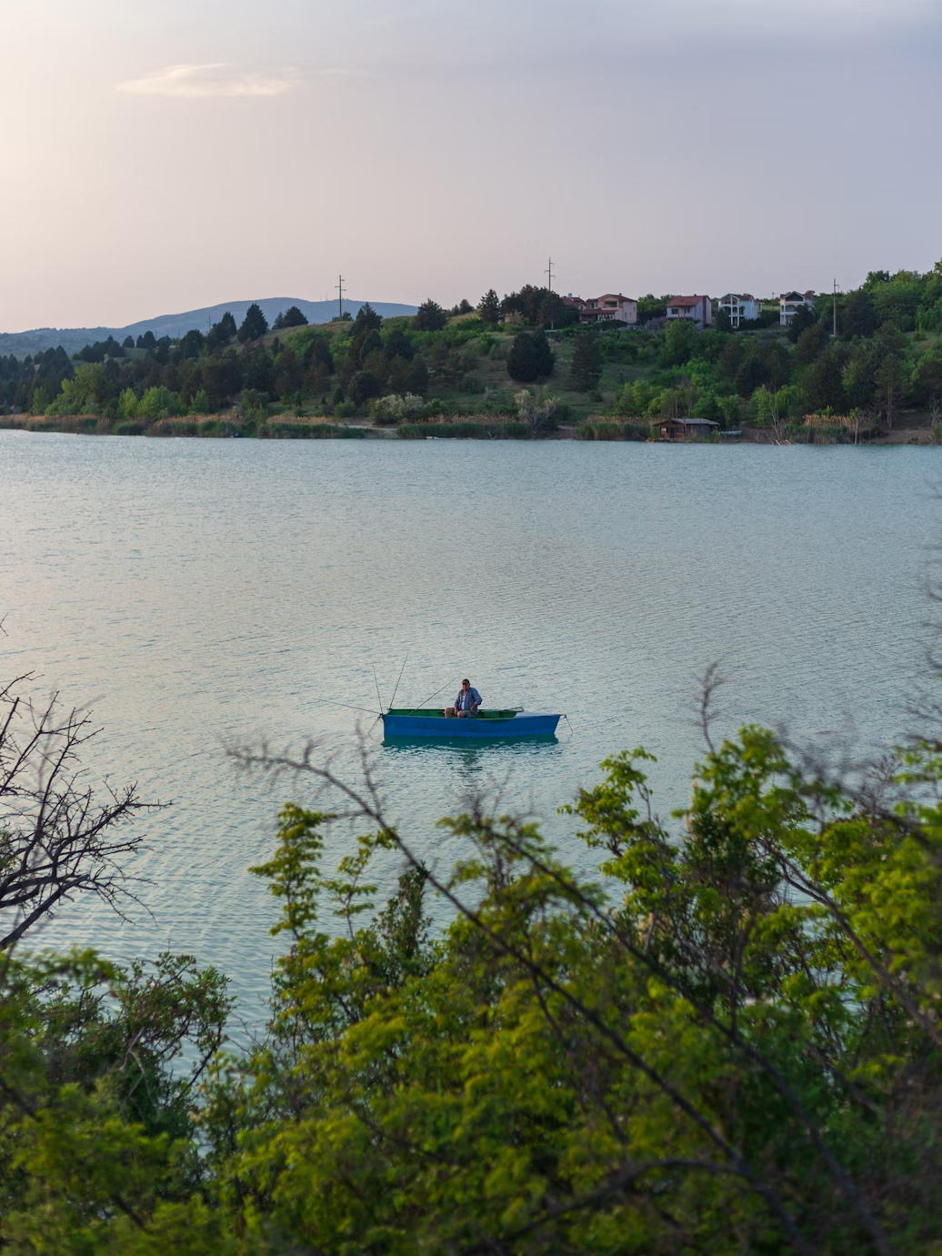 A render of three white cylindrical columns, against a warm creme background